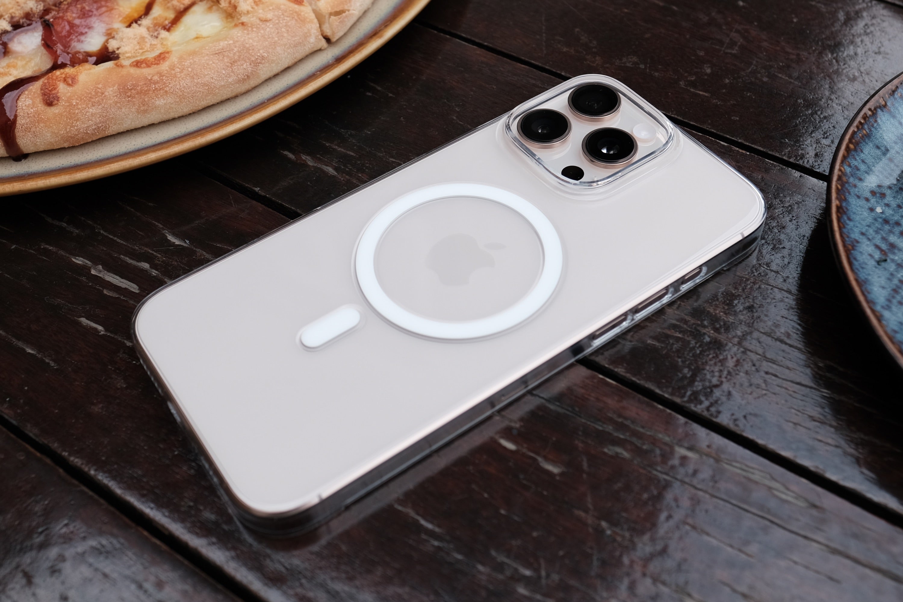 The Bare Case - Thinnest Clear MagSafe Case for iPhone 16 Series - Desert Titanium - on Table - Banner